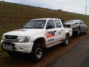 Dot Towing vehicle towing damaged vehicle